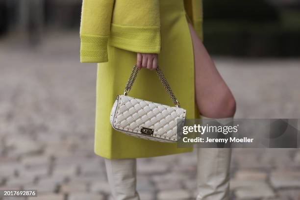 Anna Hiltrop seen wearing Escada yellow / lime green zip midi dress, matching Escada yellow / lime green wool short coat / bomber jacket, Valentino...