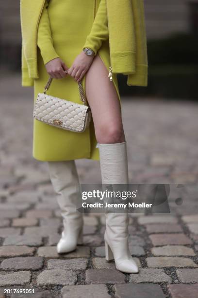 Anna Hiltrop seen wearing Escada yellow / lime green zip midi dress, matching Escada yellow / lime green wool short coat / bomber jacket, Cartier...