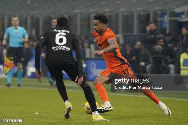 Junior Sambia of US Salernitana competes for the ball with Tajon Buchanan of FC Internazionale during the Serie A TIM match between FC Internazionale...