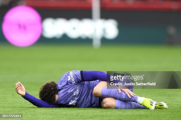 Curtis Jones of Liverpool goes down with an injury during the Premier League match between Brentford FC and Liverpool FC at Gtech Community Stadium...