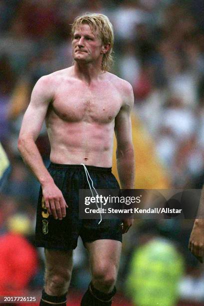 June 18: Colin Hendry of Scotland with his shirt removed looks dejected after the UEFA Euro 1996 Group A match between Scotland and Switzerland at...