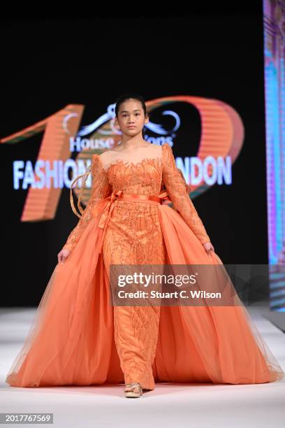 Model walks the runway for CLC Couture at the House of iKons show during London Fashion Week February on February 17, 2024 in London, England.