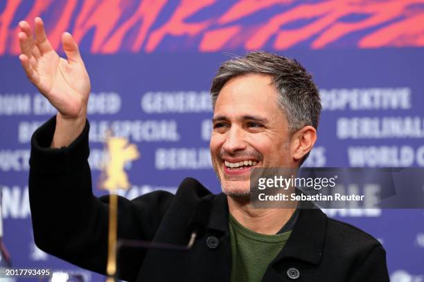 Gael García Bernal waves at the "Another End" press conference during the 74th Berlinale International Film Festival Berlin at Grand Hyatt Hotel on...