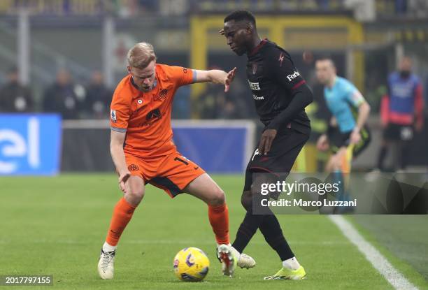 Davy Klaassen of FC Internazionale holds off Junior Sambia of US Salernitana during the Serie A TIM match between FC Internazionale and US...