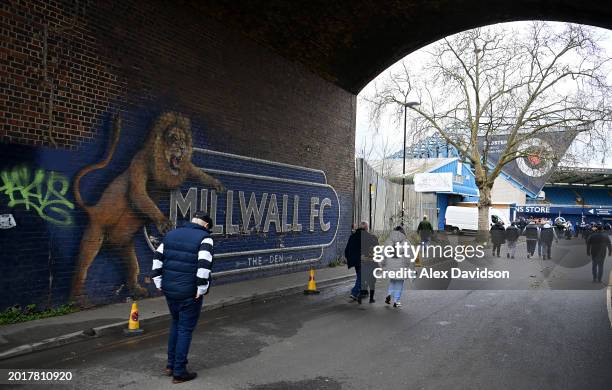 Fans arrive outside the ground ahead of the Sky Bet Championship match between Millwall and Sheffield Wednesday at The Den on February 17, 2024 in...