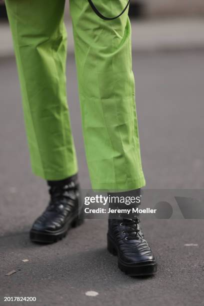 Anna Hiltrop seen wearing Michael Kors light green suit long pants and Gucci black leather laced boots, on February 16, 2024 in Berlin, Germany.