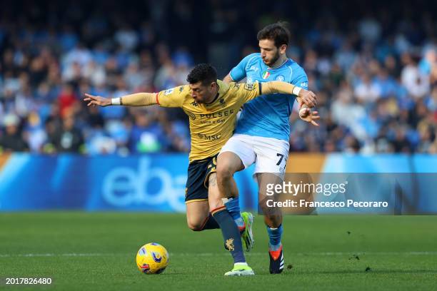Stefano Sabelli of Genoa CFC battles for possession with Khvicha Kvaratskhelia of SSC Napoli during the Serie A TIM match between SSC Napoli and...