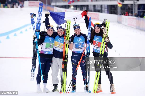 Sophie Chauveau, Justine Braisaz-Bouchet, Julia Simon and Lou Jeanmonnot of France pose for a photo after the Women's Relay in the IBU World...