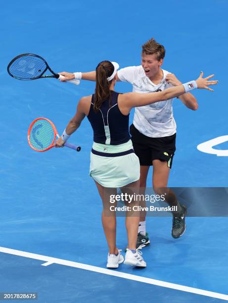 Demi Schuurs of the Netherlands and Luisa Stefani of Brazil celebrate match point with their straight sets victory against Desirae Krawczyk and...