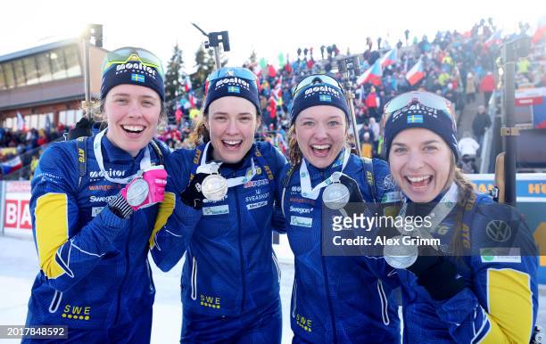 Anna Magnusson, Linn Persson, Hanna Oeberg and Elvira Oeberg of Sweden pose for a photo on the podium after finishing in Second Place after the...