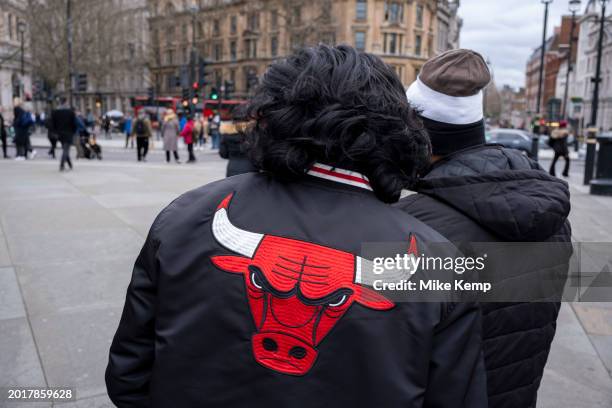 Man wearing a Chicago Bulls jacket on 5th February 2024 in London, United Kingdom. The Chicago Bulls are an American professional basketball team who...