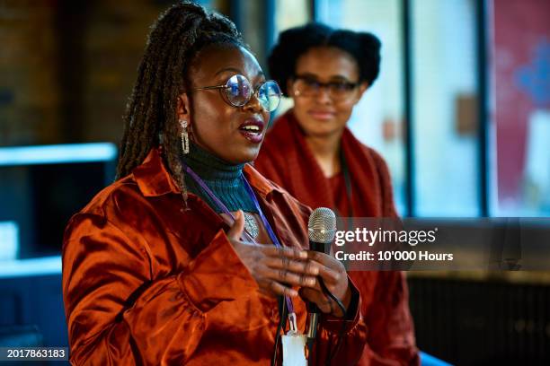 multi racial businesswoman giving speech at seminar - candidate stock pictures, royalty-free photos & images
