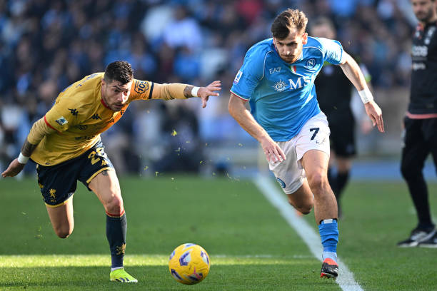 Khvicha Kvaratskhelia of SSC Napoli battles for possession with Stefano Sabelli of Genoa CFC during the Serie A TIM match between SSC Napoli and...