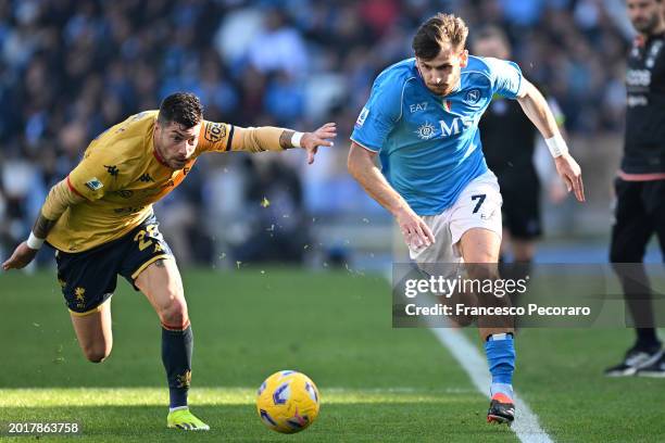 Khvicha Kvaratskhelia of SSC Napoli battles for possession with Stefano Sabelli of Genoa CFC during the Serie A TIM match between SSC Napoli and...