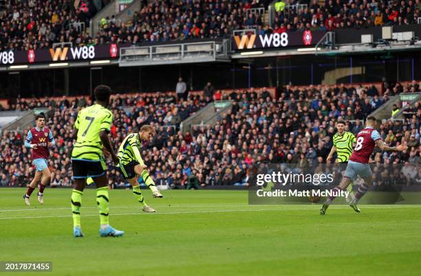 Martin Odegaard of Arsenal scores his team's first goal during the Premier League match between Burnley FC and Arsenal FC at Turf Moor on February...