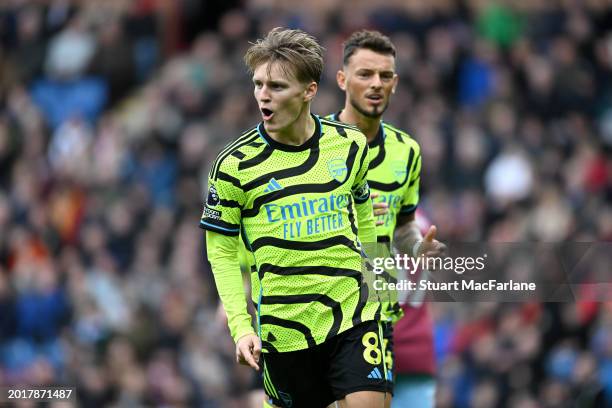 Martin Odegaard of Arsenal celebrates after scoring his team's first goal during the Premier League match between Burnley FC and Arsenal FC at Turf...