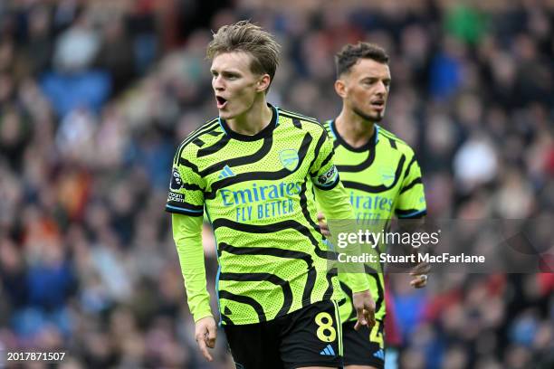 Martin Odegaard of Arsenal celebrates after scoring his team's first goal during the Premier League match between Burnley FC and Arsenal FC at Turf...