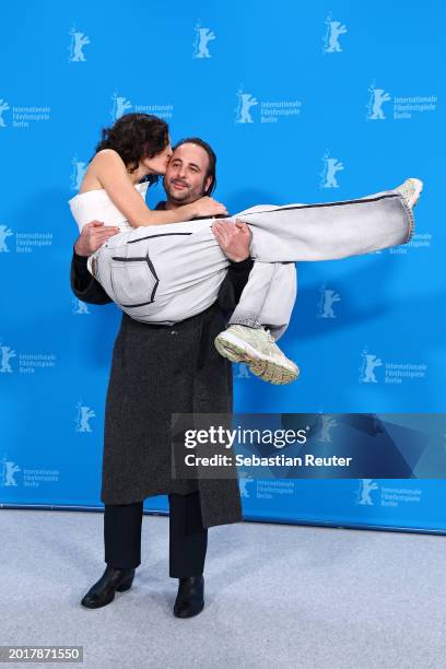 Nina d'Urso kisses as Vincent Macaigne lifts her up at the "Hors du temps" photocall during the 74th Berlinale International Film Festival Berlin at...