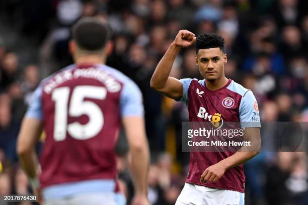 Ollie Watkins of Aston Villa celebrates scoring his team's first goal during the Premier League match between Fulham FC and Aston Villa at Craven...
