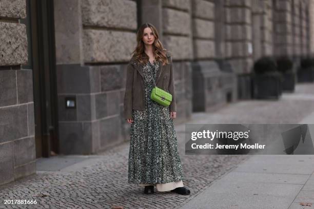 Anna Hiltrop seen wearing Boss green / beige / black print pattern pleated long dress, Boss brown suede leather jacket, Michael Kors green leather...