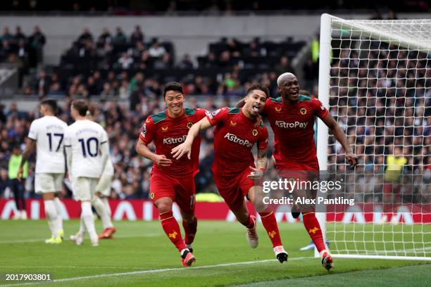 Joao Gomes celebrates with Hwang Hee-Chan and Toti Gomes of Wolverhampton Wanderers after scoring his team's first goal during the Premier League...