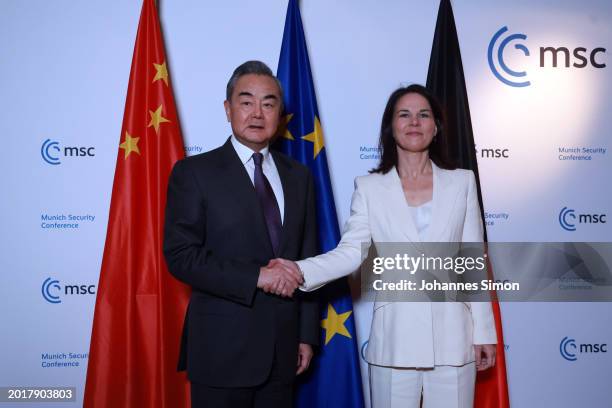 China's minister of foreign affairs Wang Yi and his German counterpart Annalena Baerbock arrive for bilateral meeting at the 2024 Munich Security...