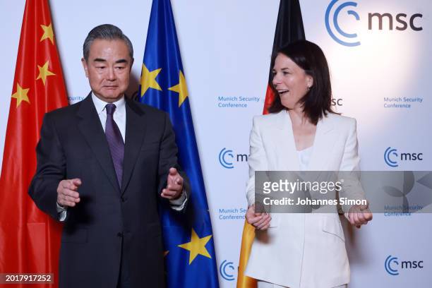 China's minister of foreign affairs Wang Yi and his German counterpart Annalena Baerbock arrive for bilateral meeting at the 2024 Munich Security...