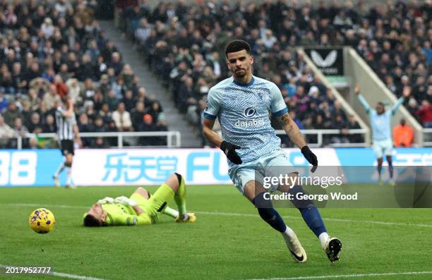 Dominic Solanke of AFC Bournemouth scores his team's first goal against Martin Dubravka of Newcastle United during the Premier League match between...