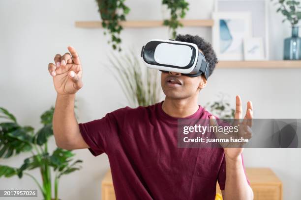 man exploring virtual reality - virtual stock pictures, royalty-free photos & images