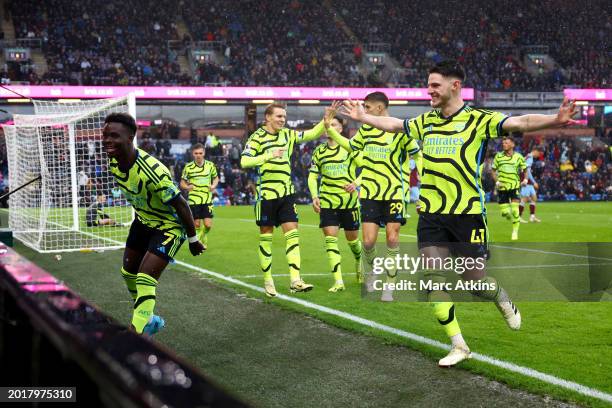 Bukayo Saka of Arsenal celebrates with teammates after scoring his team's third goal during the Premier League match between Burnley FC and Arsenal...