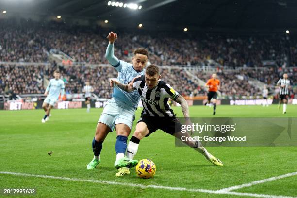 Kieran Trippier of Newcastle United is challenged by Marcus Tavernier of AFC Bournemouth during the Premier League match between Newcastle United and...