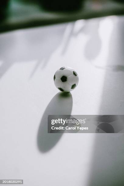 soccer ball in white surface casting shadows - football toy stock pictures, royalty-free photos & images