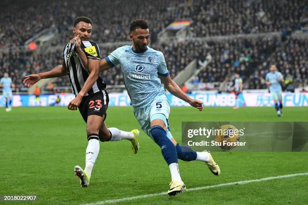 Lloyd Kelly of AFC Bournemouth battles for possession with Jacob Murphy of Newcastle United during the Premier League match between Newcastle United...