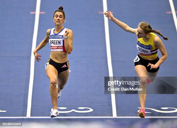 Gold medalist, Olivia Breen and Silver medalist, Madeline Down of Great Britain cross the line in the Women's Para 60m during day one of the...