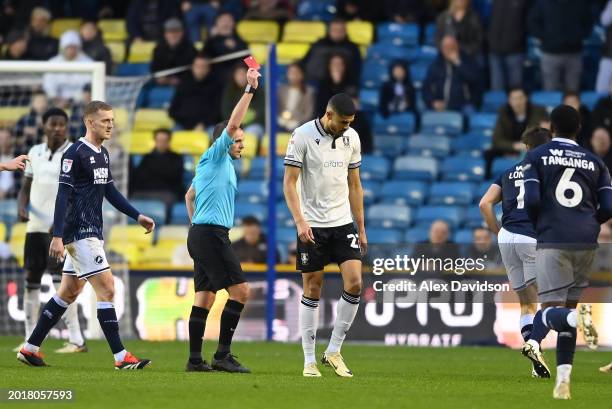 Ashley Fletcher of Sheffield Wednesday walks off after receiving a red card during the Sky Bet Championship match between Millwall and Sheffield...