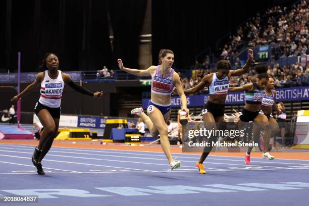 Gold medalist, Amy Hunt , Silver medalist, Mabel Akande , and Bronze medalist, Bianca Williams of Great Britain cross the line in the Women's 60m...
