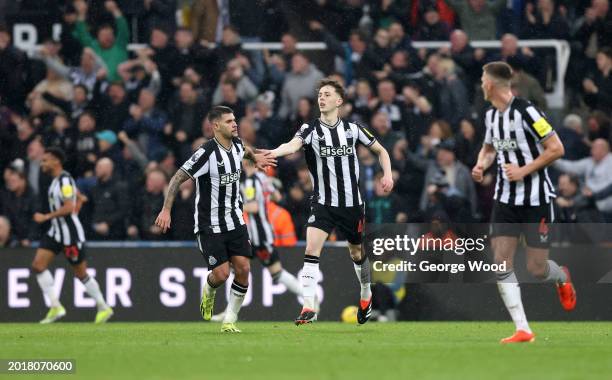 Bruno Guimaraes and Joe White of Newcastle United celebrate Matt Ritchie of Newcastle United scores second goal during the Premier League match...