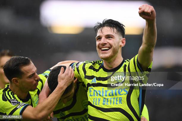 Kai Havertz of Arsenal celebrates with teammates Cedric Soares and Declan Rice after scoring their team's fifth goal during the Premier League match...