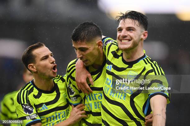 Kai Havertz of Arsenal celebrates with teammates Cedric Soares and Declan Rice after scoring their team's fifth goal during the Premier League match...