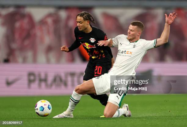 Xavi Simons of RB Leipzig is challenged by Nico Elvedi of Borussia Mönchengladbach during the Bundesliga match between RB Leipzig and Borussia...