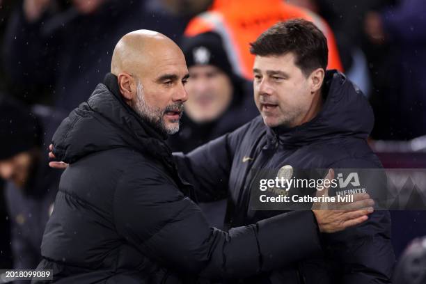 Pep Guardiola, Manager of Manchester City, and Mauricio Pochettino, Manager of Chelsea, interact prior to the Premier League match between Manchester...