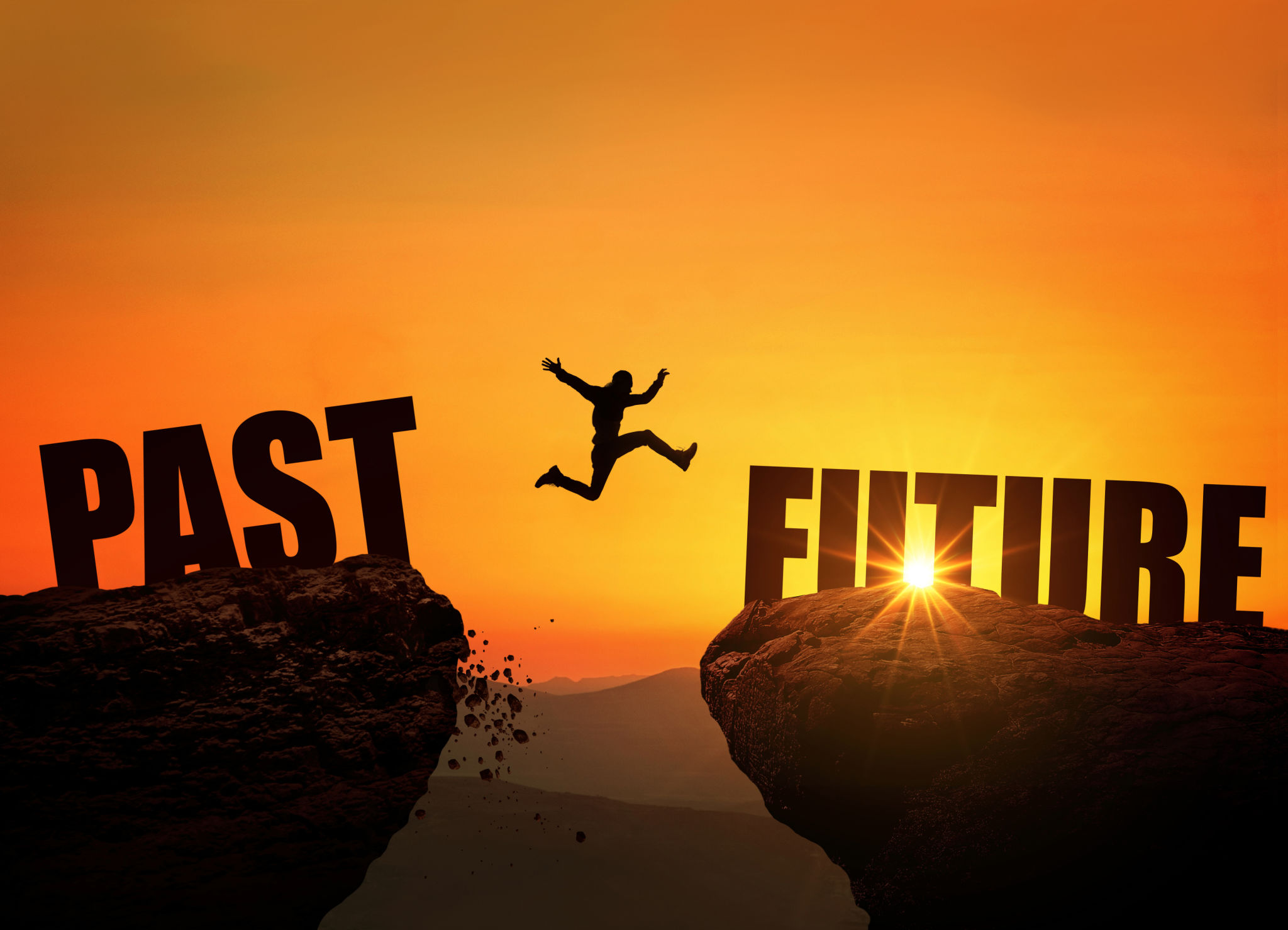 Successful man jumps over a cliff with the text Future at sunset, concept. Leap from past to future, creative idea. Rock at sunrise Successful man jumps over a cliff with the text Future at sunset, concept. Leap from past to future, creative idea. Rock at sunrise