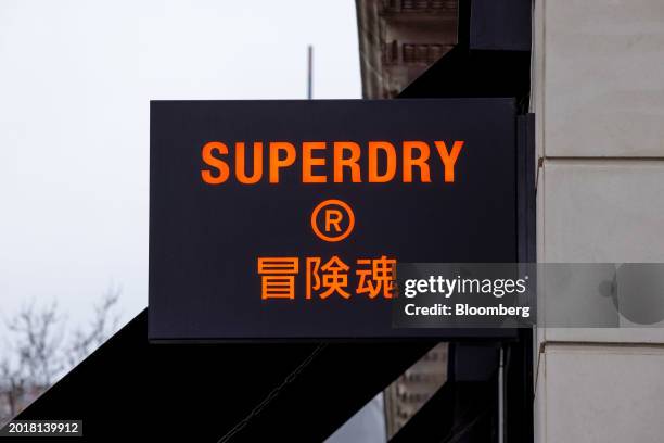 Sign at the SuperDry Plc global flagship store on Oxford Street in central London, UK, on Tuesday, Feb. 20, 2024. Julian Dunkerton, the founder and...