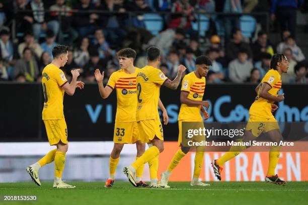 Robert Lewandowski of FC Barcelona celebrates scoring his team's first goal with teammate Pau Cubarsi of FC Barcelona during the LaLiga EA Sports...