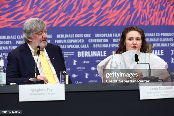 Stephen Fry and Lena Dunham speak at the "Treasure" press conference during the 74th Berlinale International Film Festival Berlin at Grand Hyatt...