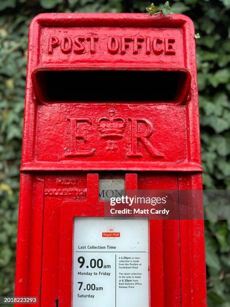 Plants grow around a traditional Post Office Royal Mail red post box on February 17, 2024 in Priston, England. The British Prime Minister Rishi Sunak...