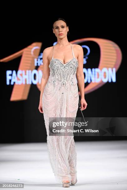 Model walks the runway for Bold Black Dresses - The Fashion Life Tour at the House of iKons show during London Fashion Week February on February 17,...