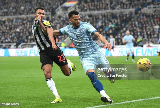 Lloyd Kelly of AFC Bournemouth battles for possession with Jacob Murphy of Newcastle United during the Premier League match between Newcastle United...