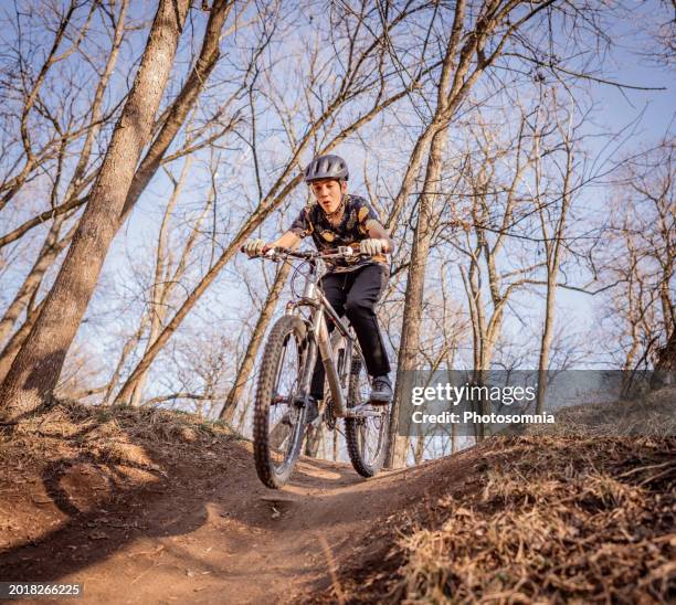 teenage mountain bikers having fun - wheelie stock pictures, royalty-free photos & images