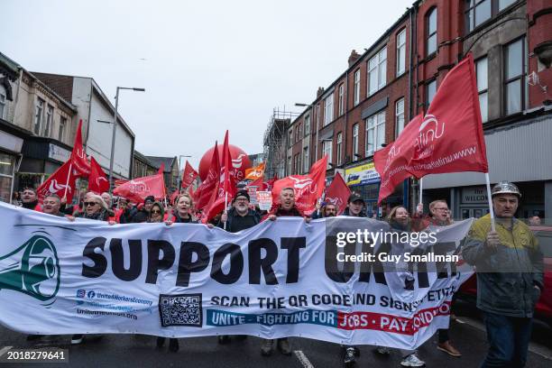 Steel workers and their supporters march though Port Talbot on February 17, 2024 in Port Talbot, Wales.